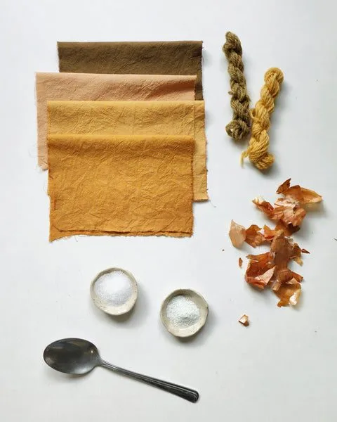Onion-skin dye samples on cotton and wool with different mordants and binders