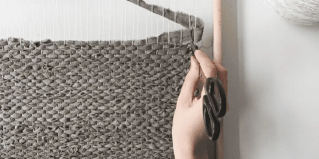 Weaving a rag rug on a frame loom
